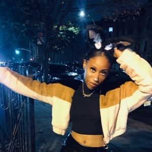 3 Toned zip up fur jacket.